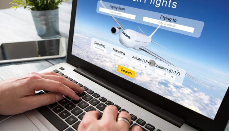 booking a flight online through website on laptop