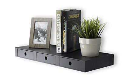 floating drawer with a plant, a photo, and books on top